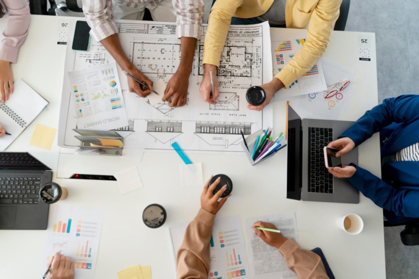 Professional team analyzing link building strategies and digital marketing data on multiple screens